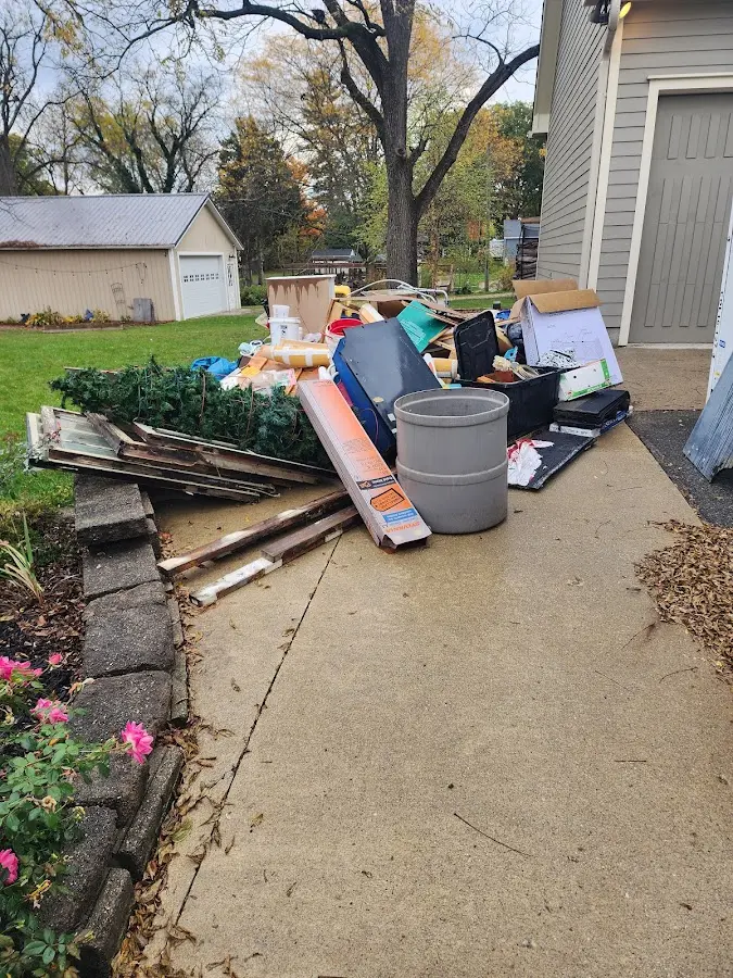 Dumpster being loaded with debris for 10 Yard Dumpster Rental in Antioch